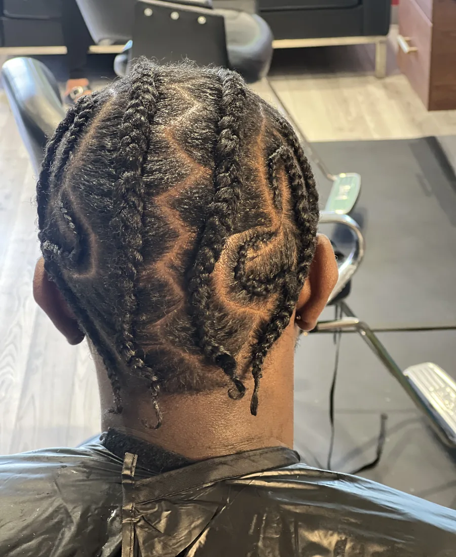 Cornrows braided in curved patterns
